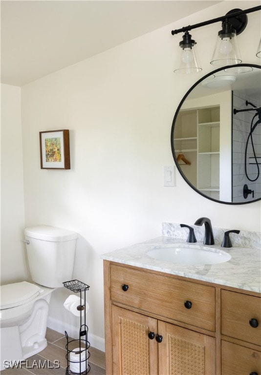 bathroom with tile patterned floors, vanity, and toilet