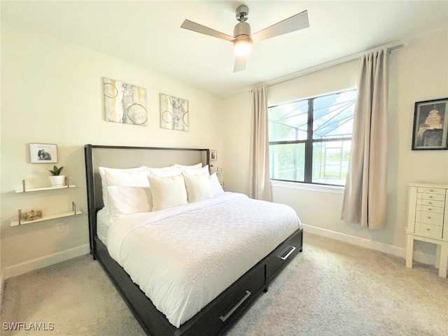 bedroom featuring ceiling fan and light carpet