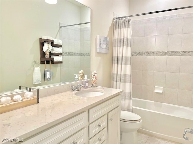 full bathroom featuring tile patterned floors, shower / tub combo with curtain, vanity, and toilet