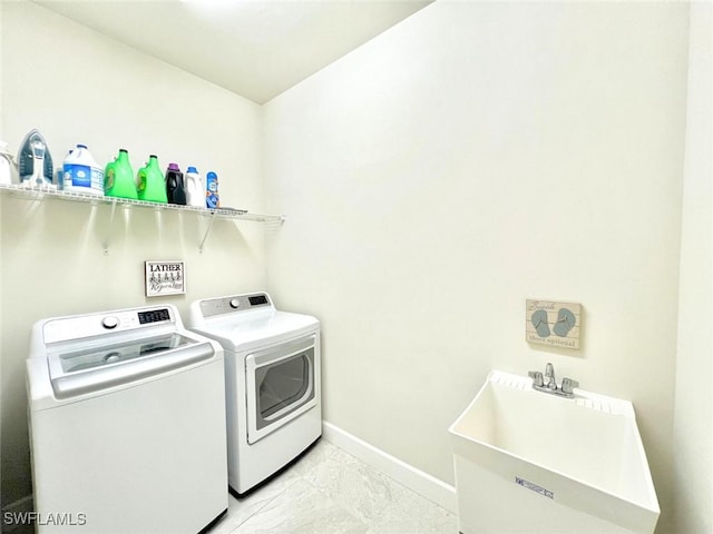 laundry area with washer and dryer and sink