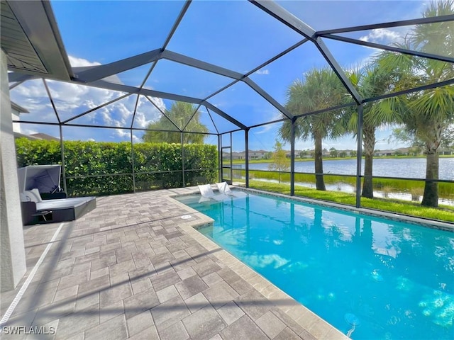 view of swimming pool with a lanai, a water view, and a patio