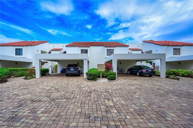 mediterranean / spanish home with a carport