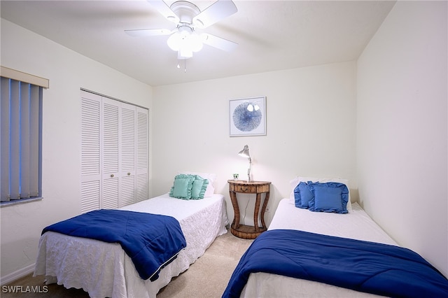 carpeted bedroom featuring a closet and ceiling fan