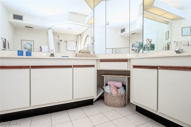 bathroom featuring vanity and tile patterned flooring