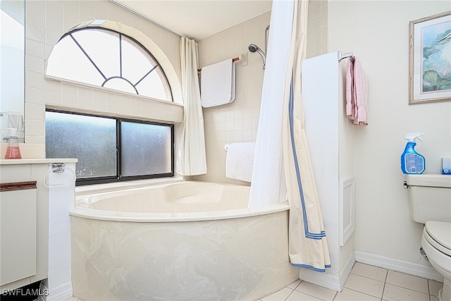 bathroom featuring a bath, toilet, and tile patterned flooring