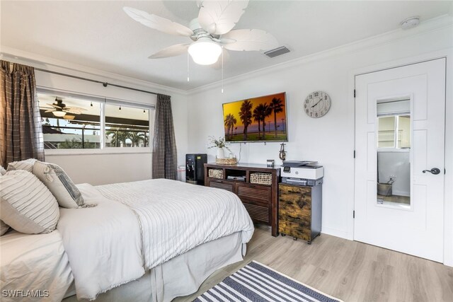 bedroom featuring ornamental molding, ceiling fan, and light hardwood / wood-style floors