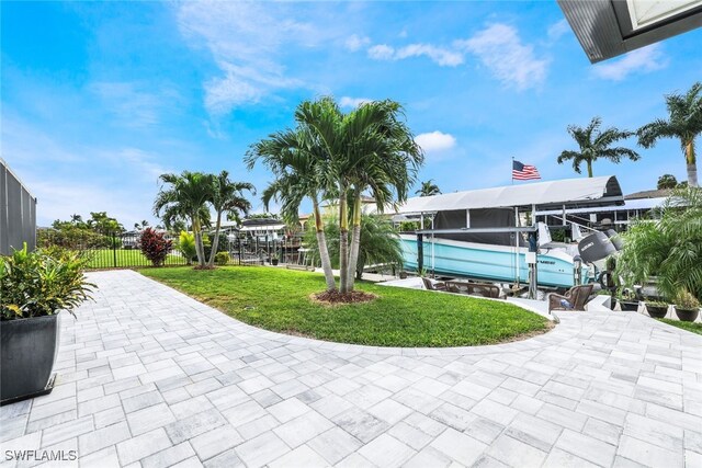 view of patio / terrace featuring a lanai