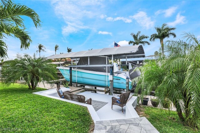 back of property with a lanai and a yard