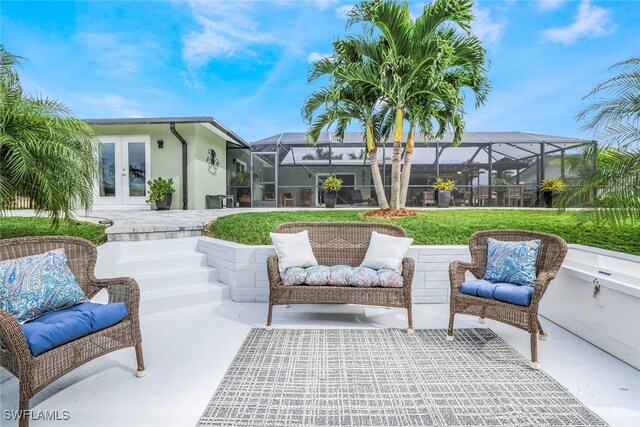 view of patio / terrace featuring french doors and glass enclosure