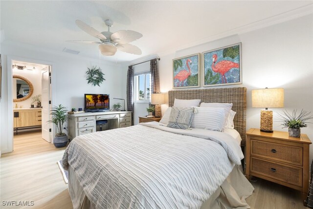 bedroom featuring ensuite bathroom, light hardwood / wood-style flooring, a baseboard heating unit, ceiling fan, and ornamental molding