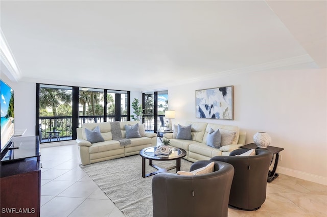 tiled living room featuring ornamental molding and floor to ceiling windows