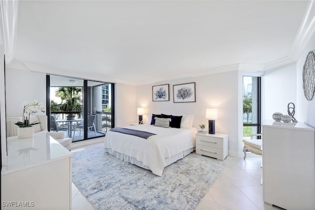 tiled bedroom with ornamental molding and access to outside