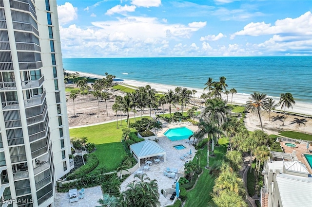 bird's eye view with a beach view and a water view