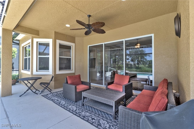 view of patio with ceiling fan and an outdoor hangout area