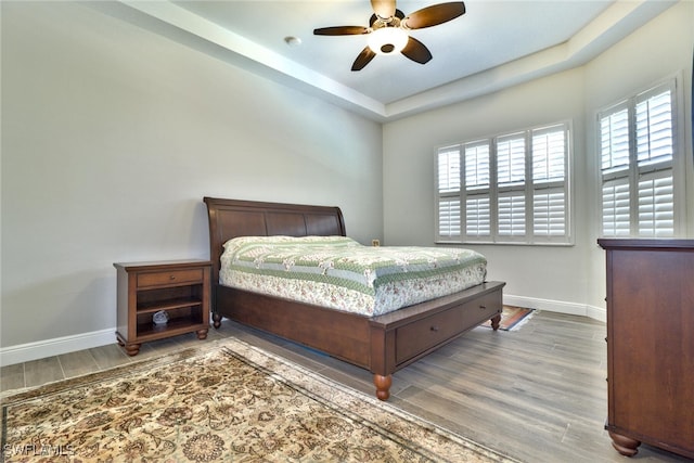 bedroom featuring wood-type flooring and ceiling fan