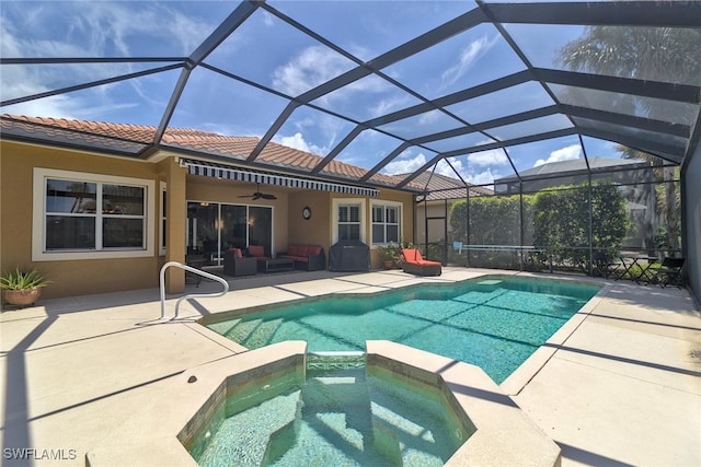 view of pool featuring a lanai, ceiling fan, outdoor lounge area, a patio, and an in ground hot tub