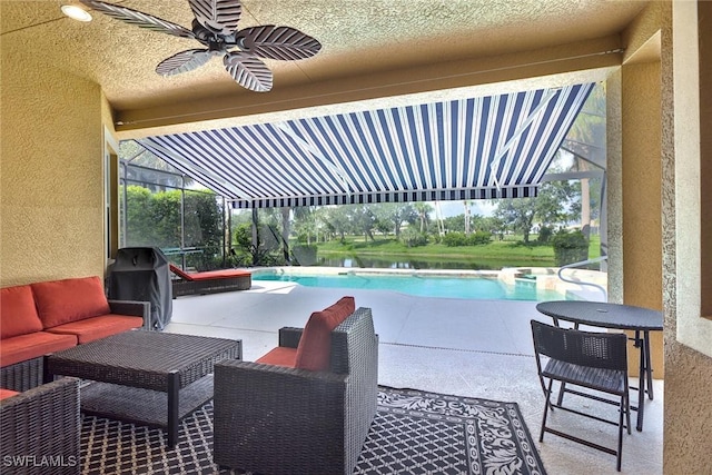 view of swimming pool featuring area for grilling, an outdoor living space, a lanai, and a patio area