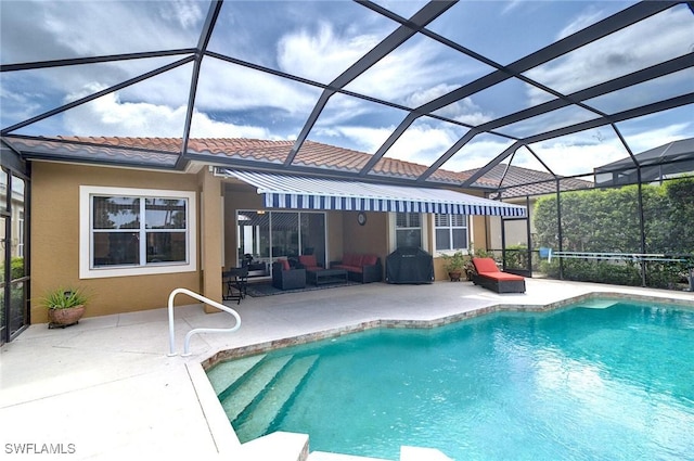 view of swimming pool with area for grilling, outdoor lounge area, a patio, and a lanai