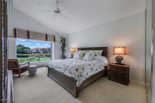 carpeted bedroom featuring ceiling fan and vaulted ceiling