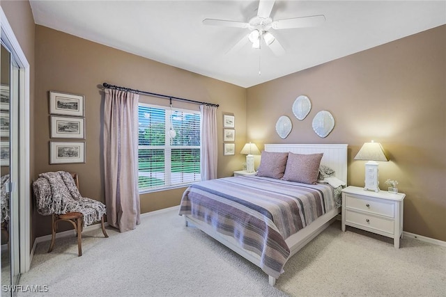 bedroom with light carpet and ceiling fan