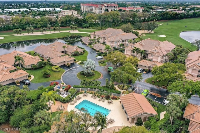 birds eye view of property with a water view