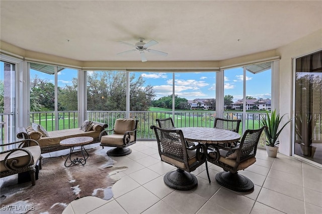 sunroom with plenty of natural light and ceiling fan