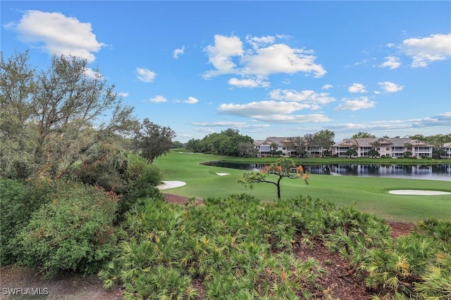 surrounding community featuring a water view and a yard