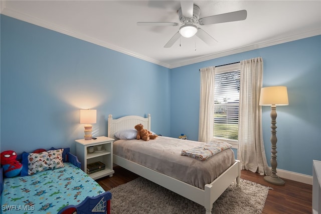 bedroom with ceiling fan, dark hardwood / wood-style flooring, and ornamental molding