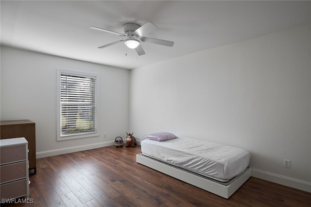 bedroom featuring ceiling fan and dark hardwood / wood-style flooring