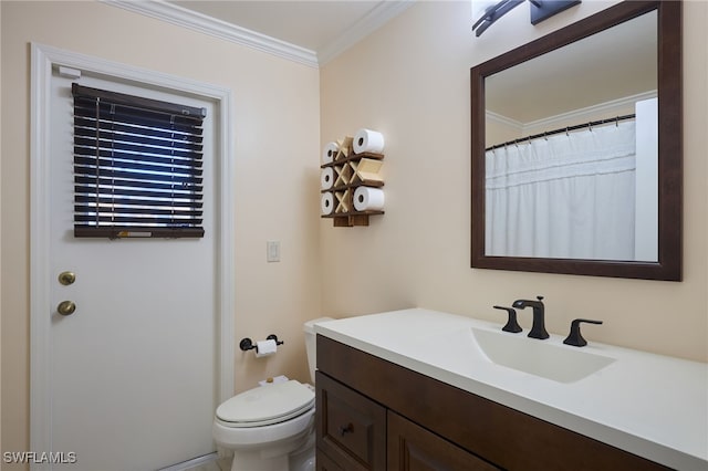 bathroom featuring toilet, ornamental molding, and vanity