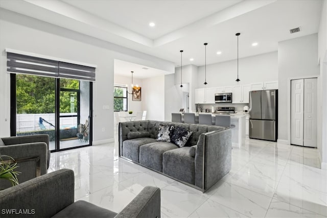 living room with an inviting chandelier