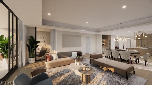 living room with a notable chandelier and a tray ceiling