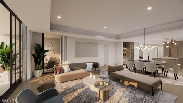 living area featuring a tray ceiling, recessed lighting, and a chandelier