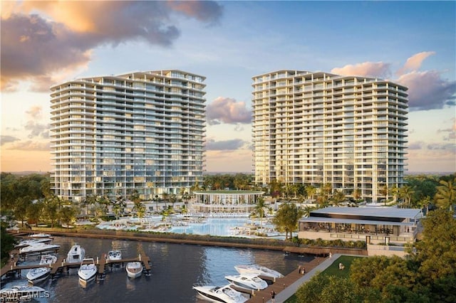 view of building exterior with a city view and a water view