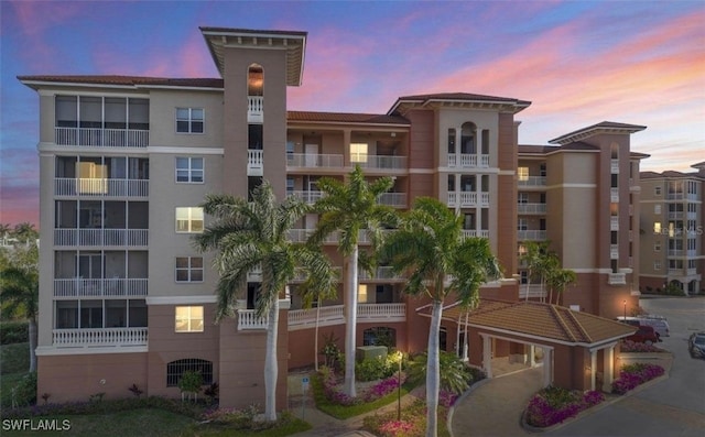 view of outdoor building at dusk