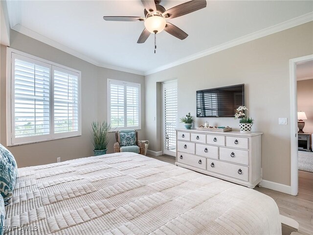 bedroom featuring light wood-type flooring, ornamental molding, and ceiling fan