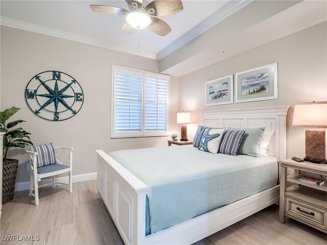 bedroom featuring ornamental molding, ceiling fan, and light hardwood / wood-style floors