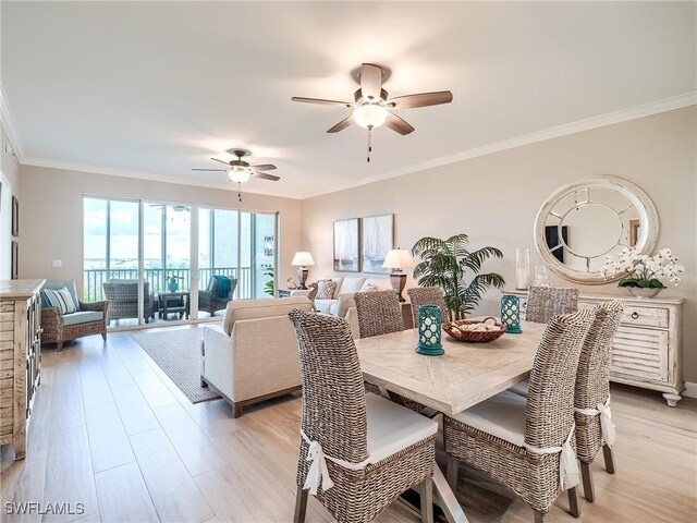 dining area with ceiling fan, light hardwood / wood-style floors, and crown molding