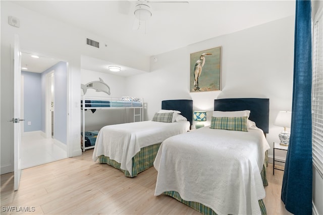 bedroom featuring ceiling fan and hardwood / wood-style flooring