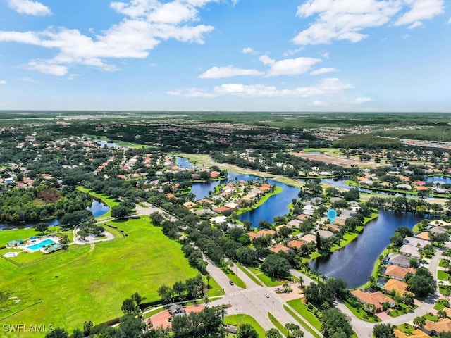 birds eye view of property featuring a water view