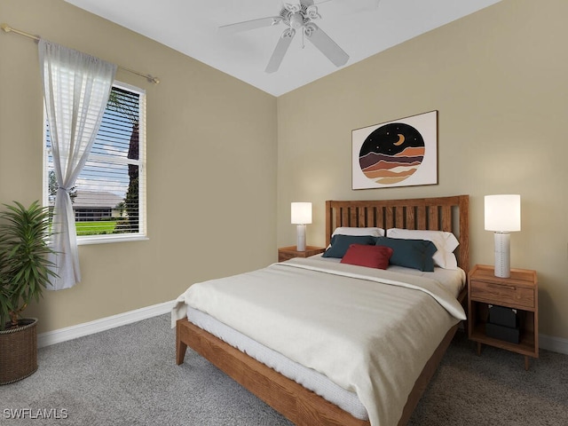 carpeted bedroom with ceiling fan and multiple windows