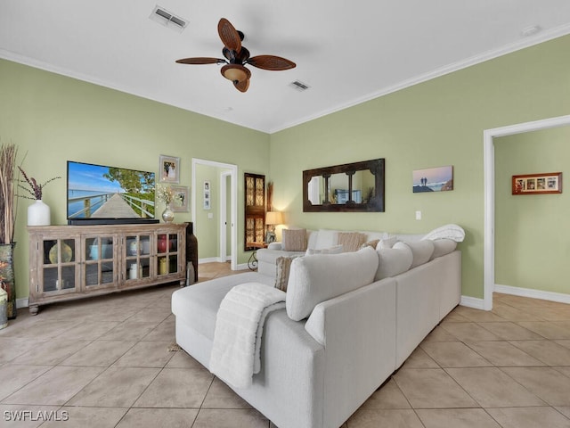 living room with light tile patterned floors, ornamental molding, and ceiling fan