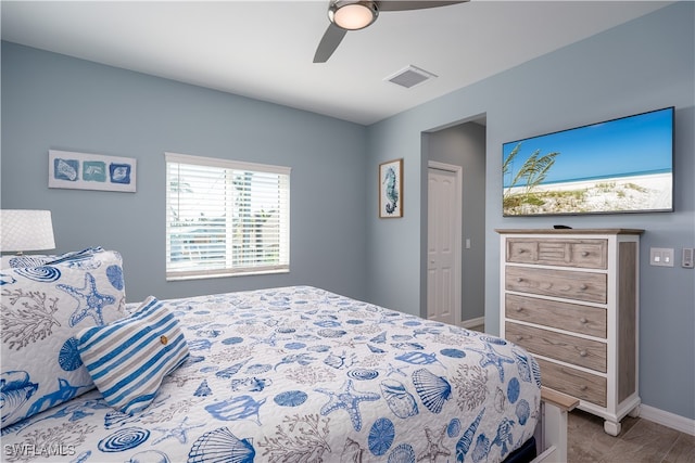 bedroom featuring ceiling fan and a closet