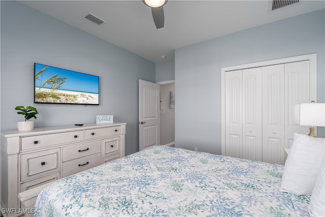 bedroom with ceiling fan and a closet