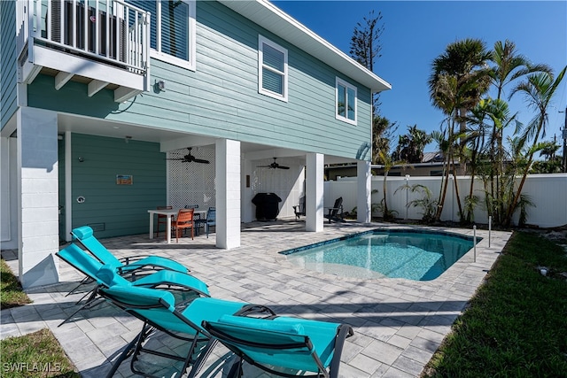 view of pool featuring ceiling fan and a patio area