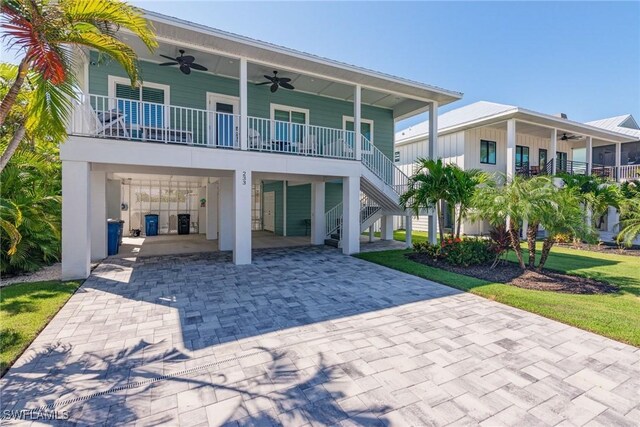 view of front of home featuring ceiling fan and covered porch