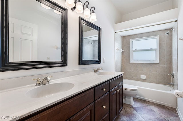 full bathroom featuring toilet, tiled shower / bath combo, and vanity