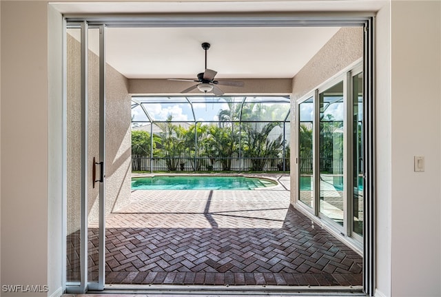 view of pool featuring ceiling fan