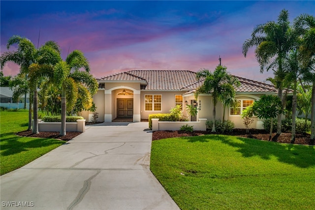 mediterranean / spanish-style house featuring a yard