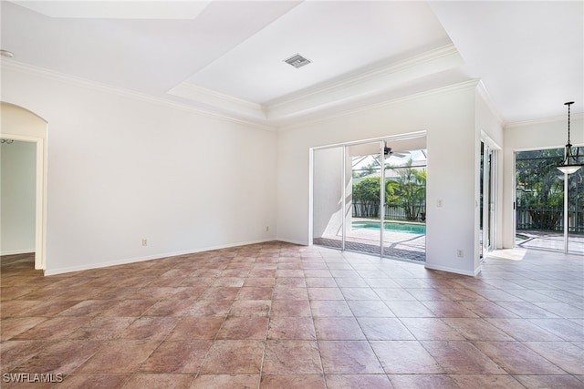 empty room with ceiling fan and ornamental molding